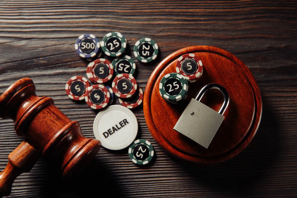 playing-chips-wooden-judge-gavel-with-padlock